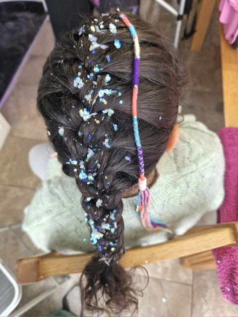 girl with festival hair style with glitter and braid in Telford